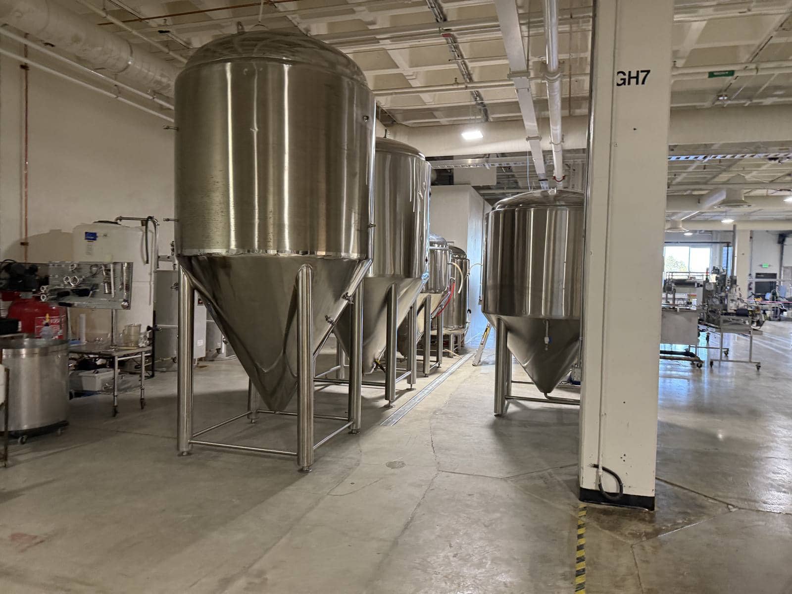 Stainless fermentation tanks on the Loveland production floor